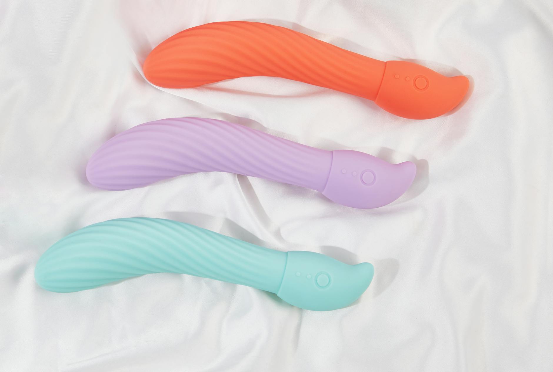 A couple standing close together indoors, exploring intimacy with a modern clitoral vibrator
